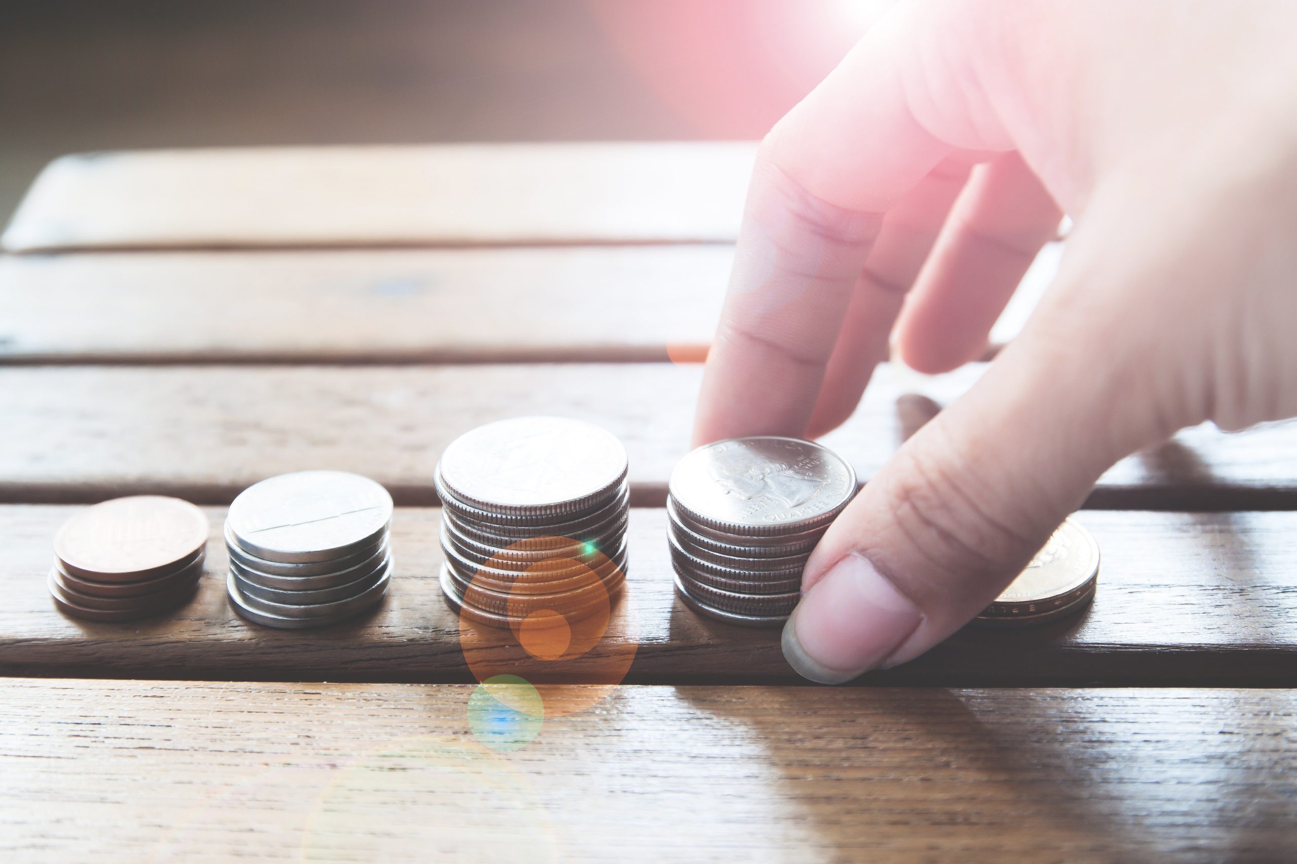 Coins stacked to show the cost of CBD vape juice